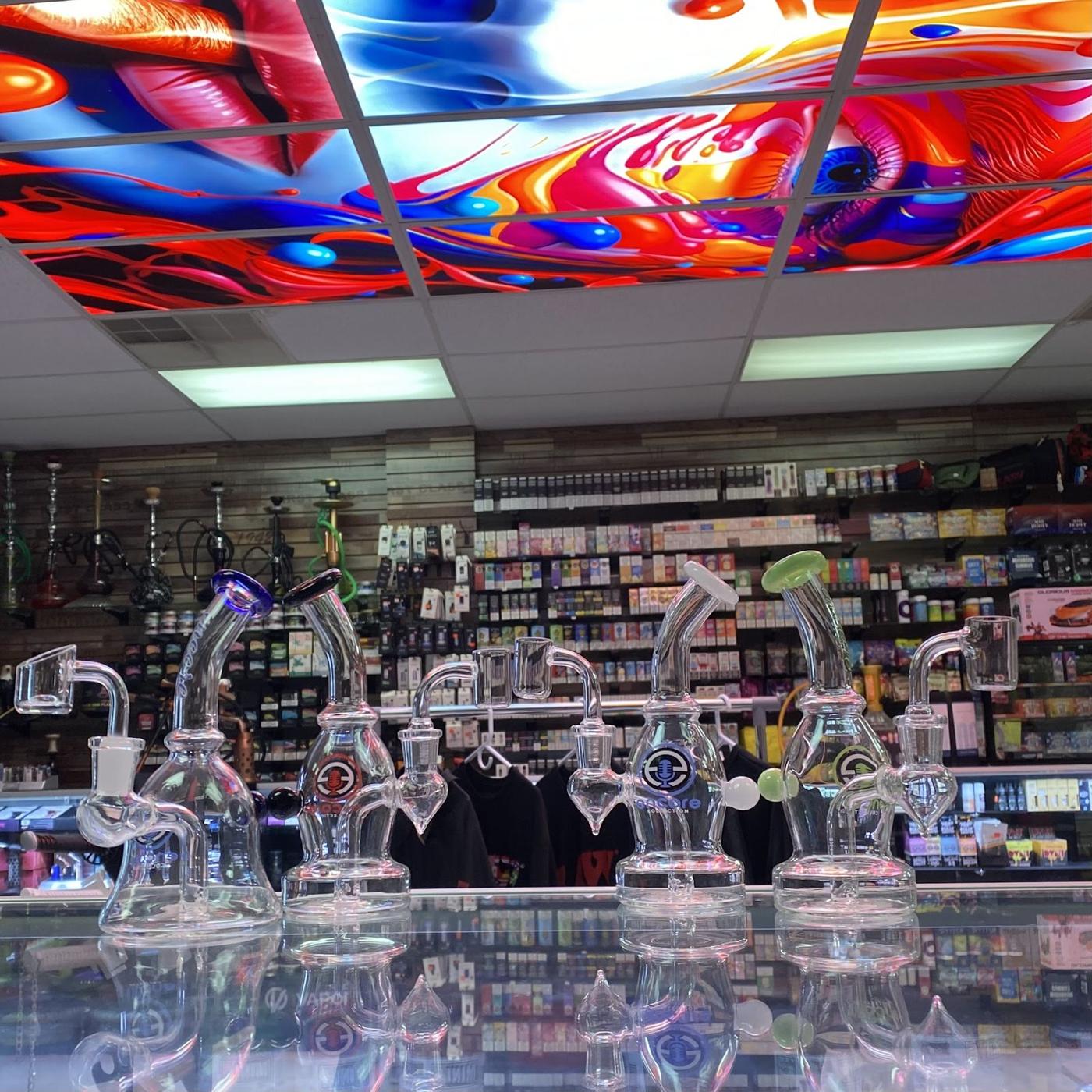 The painted ceiling and glass counter inside Spark & Smoke, Wylie
